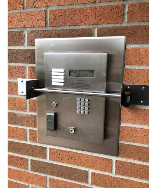 Intercom panel protected with a steel security bar.